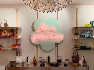 Neon signage in the shape of a cloud that reads for a good time